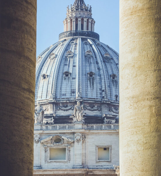 St. Peter's Basilica Through Columns - Vatican City