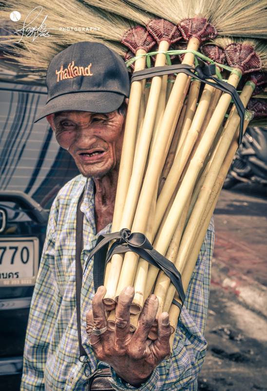 Man And His Sweepers - Bangkok, Thailand